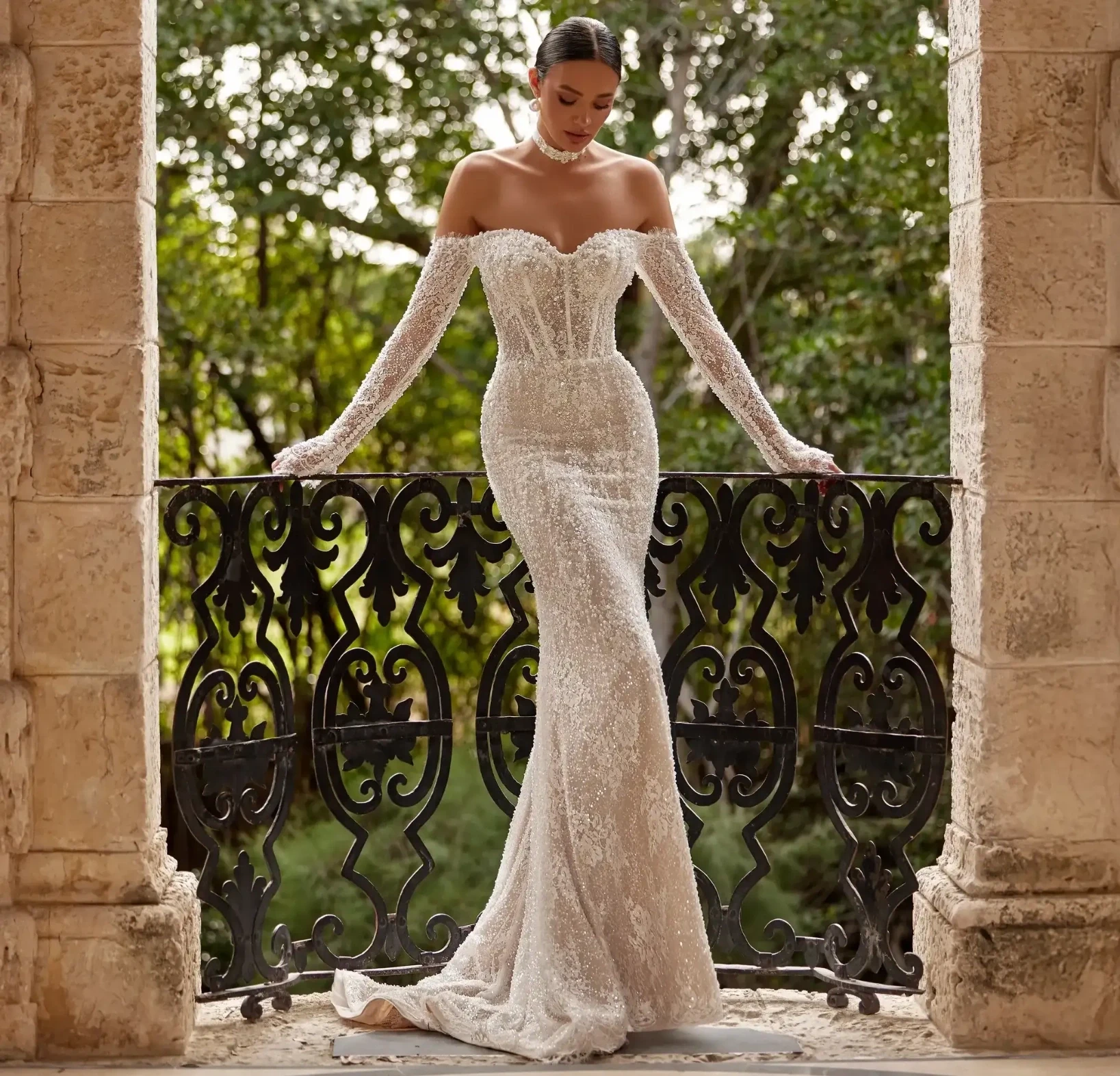 Model in wedding dress with sleeves