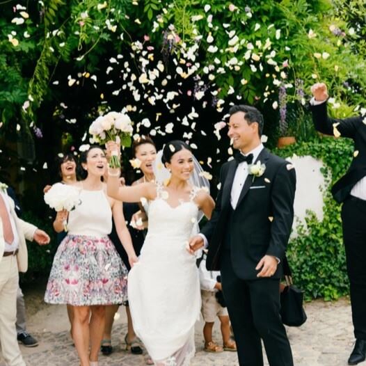 Сouple wearing a white gown and a black suit 2